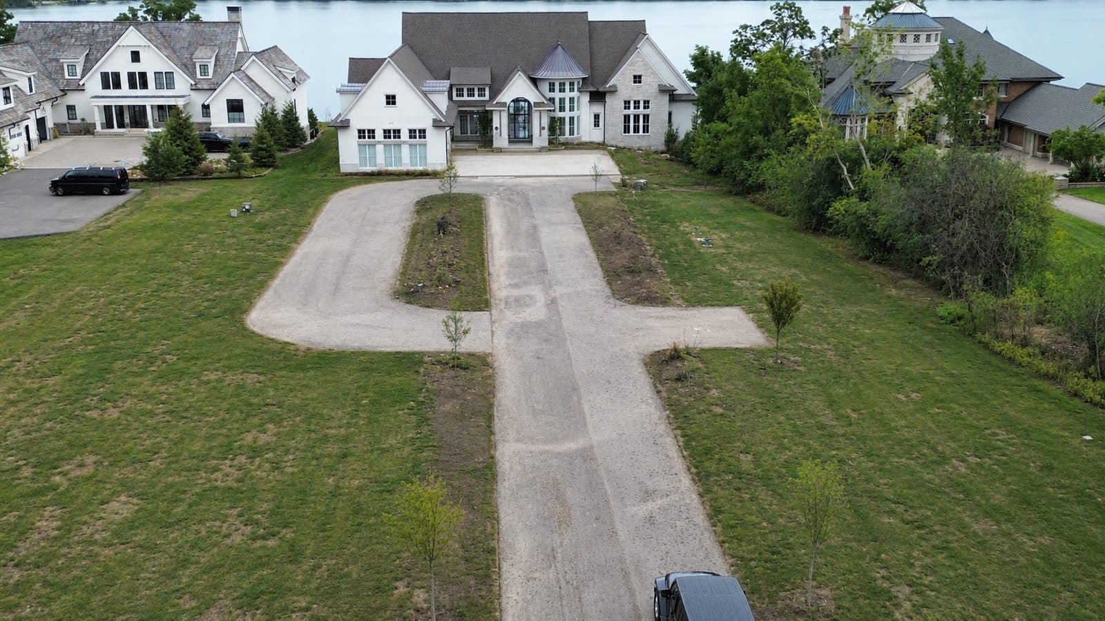 Aerial of a bare estate lawn and driveway before lawn care in Bloomfield