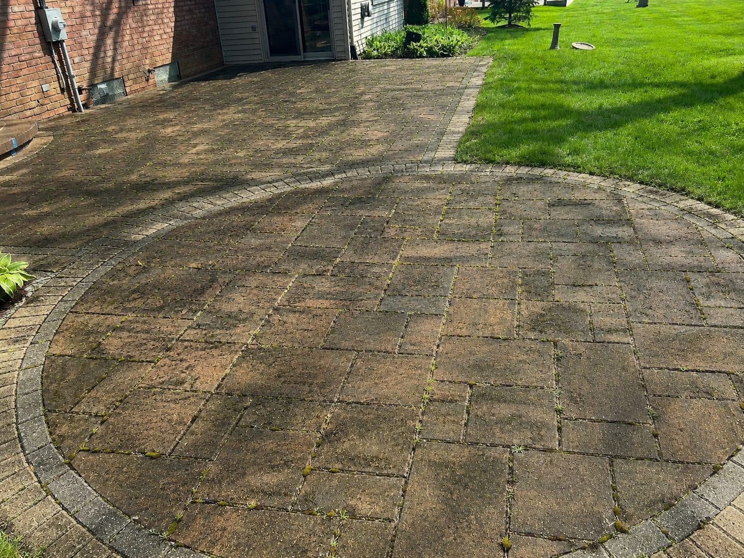 Worn paver patio before restoration in Birmingham